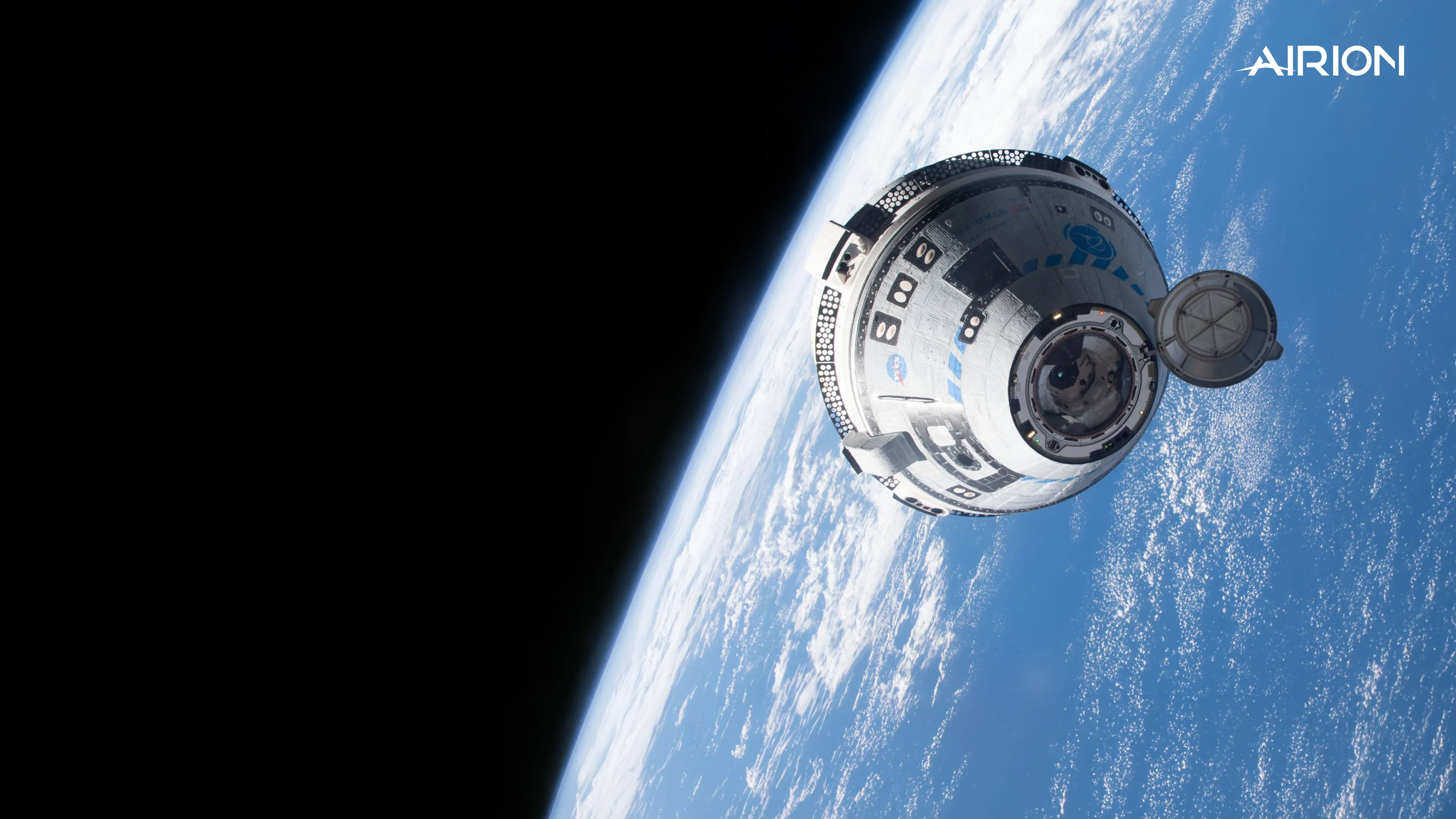 A crew capsule in orbit above Earth, where AIRUS flew as a technology demonstration.