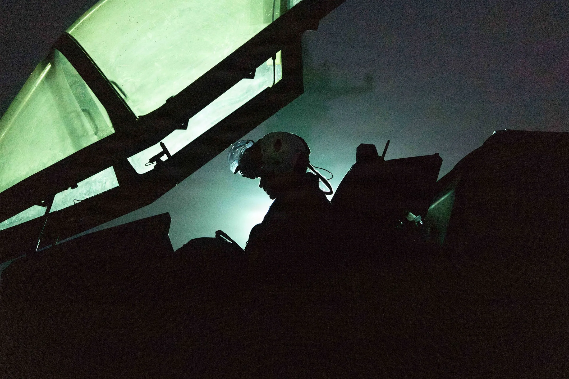 Night operations. The environment AIRUS components are engineered around — seated, strapped in, and hours from the ground.